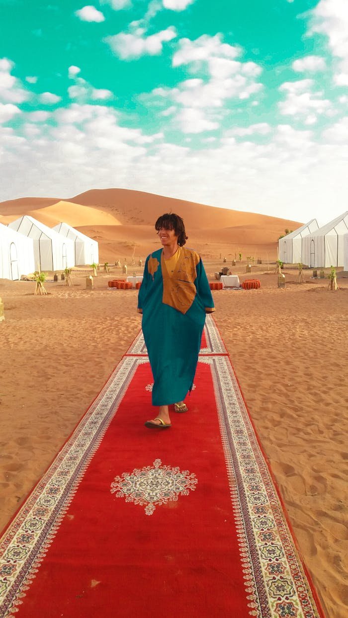 Experience a serene luxury camp in Moroccos Merzouga desert with Berber cultural elements.